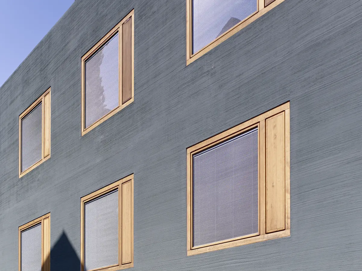 ein Gebäude mit einer grünen Fassade und gelben Fensterrahmen