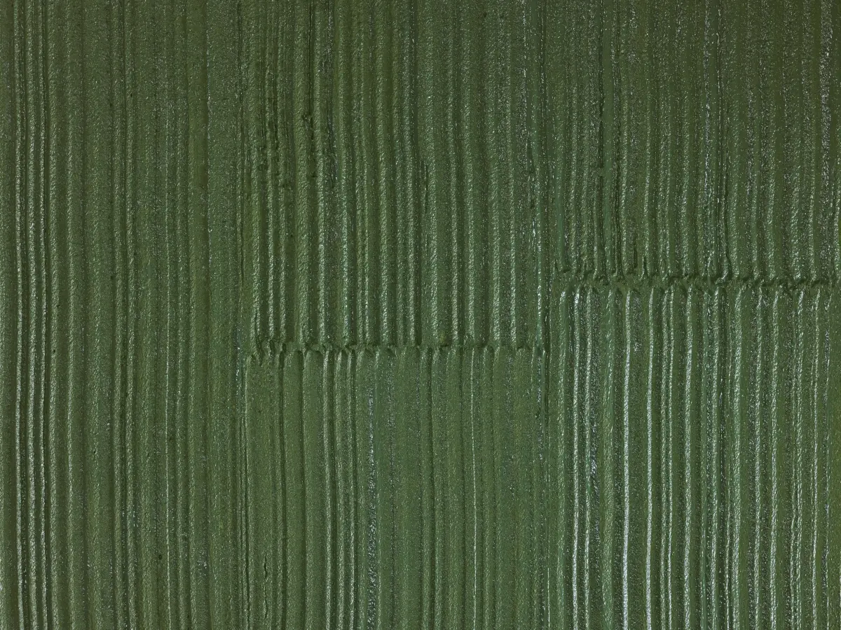 Detailaufnahme einer grünen Wandoberfläche