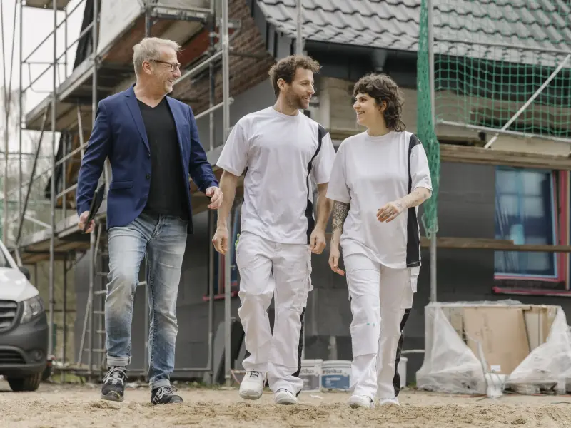 3 Personen auf einer Baustelle