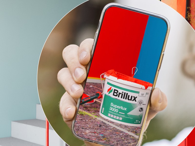 Symbolbild Gewinnspiel Handy mit Farbeimer und gestrichener Wand