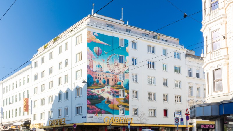 Fassadengestaltung buntes Stadtbild mit Riesenrad in Wien